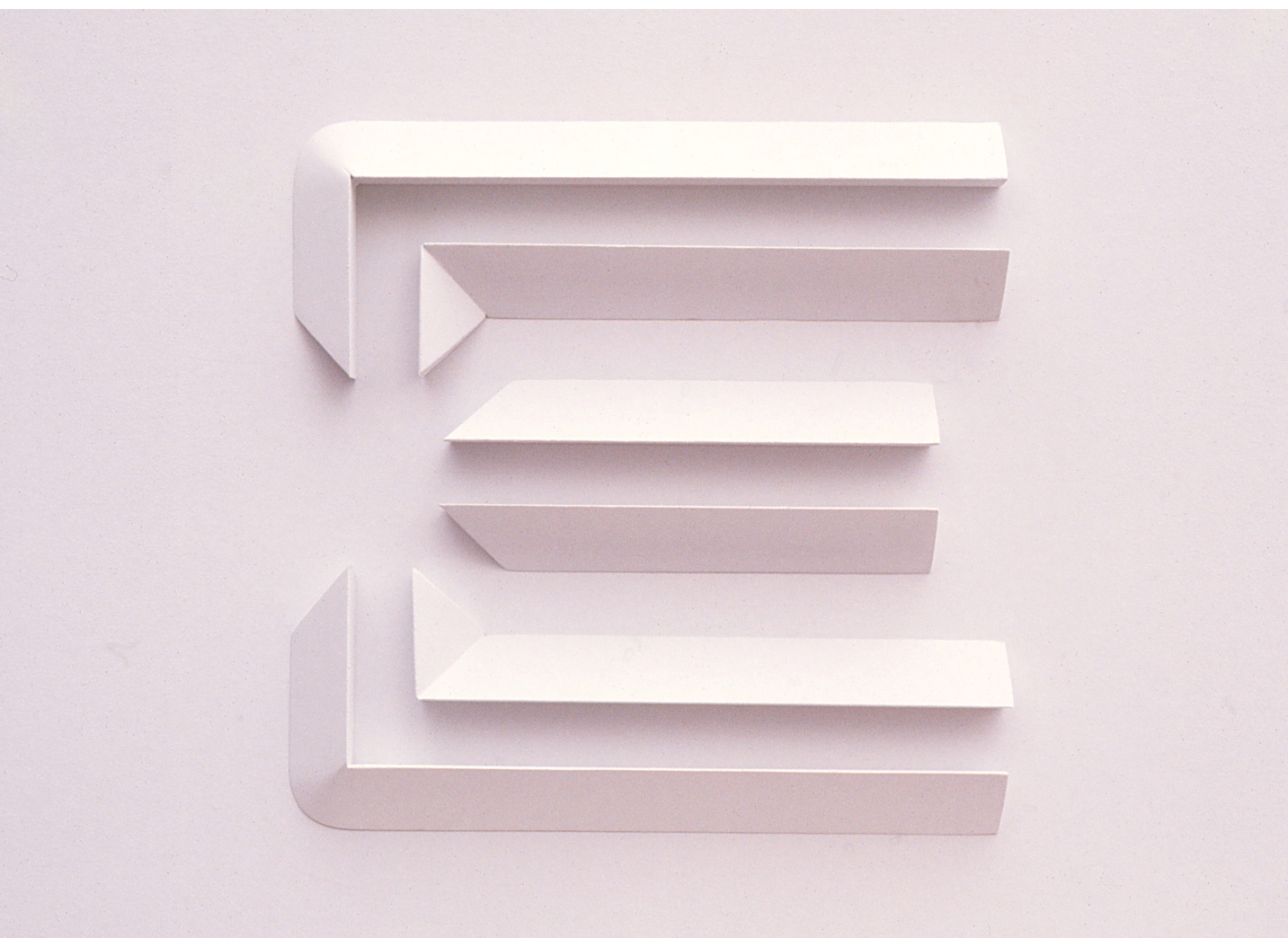 White sculpture of the E logo symbol featuring shadows to show depth and detail.