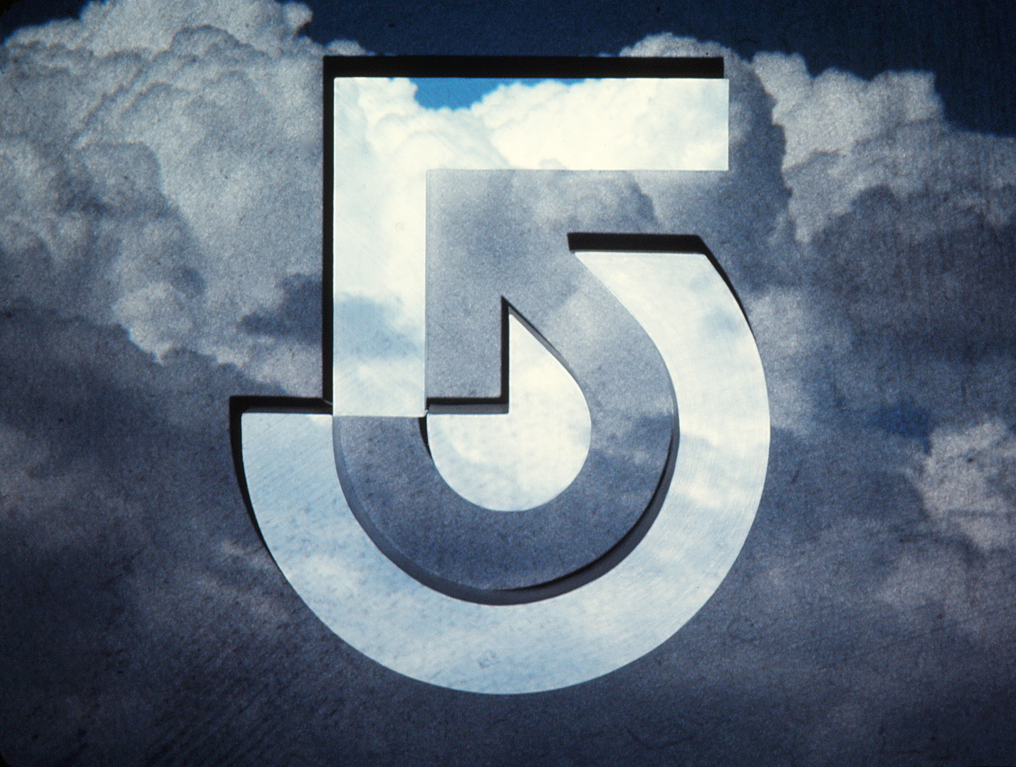 Channel 5 logo with clouds background