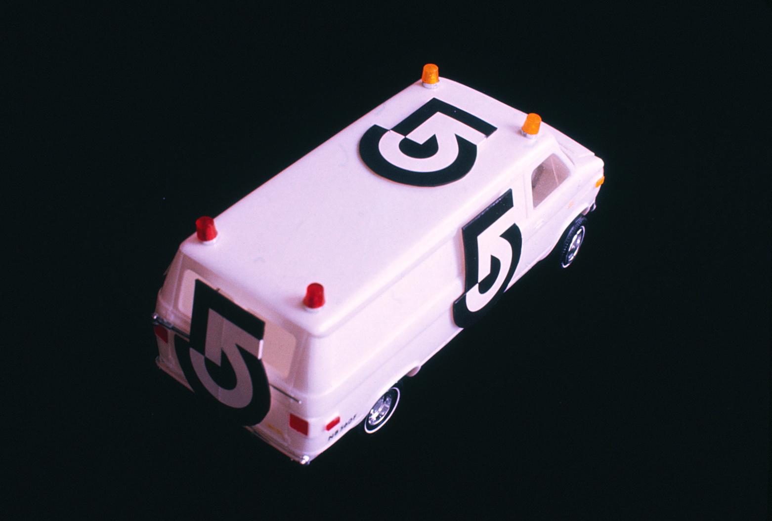 Model of van with logo on sides, back and roof