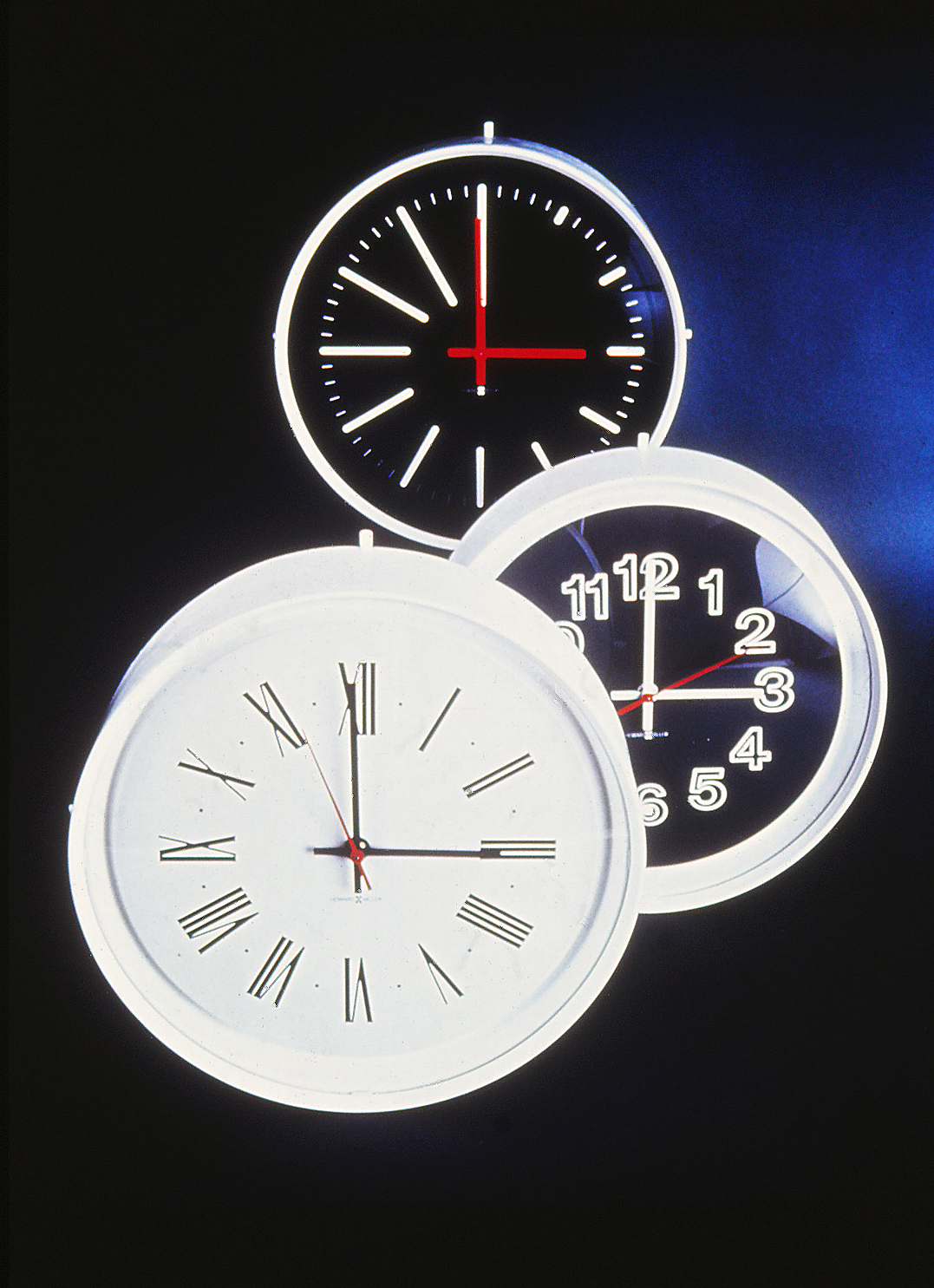 Three Institutional Clocks against a background.