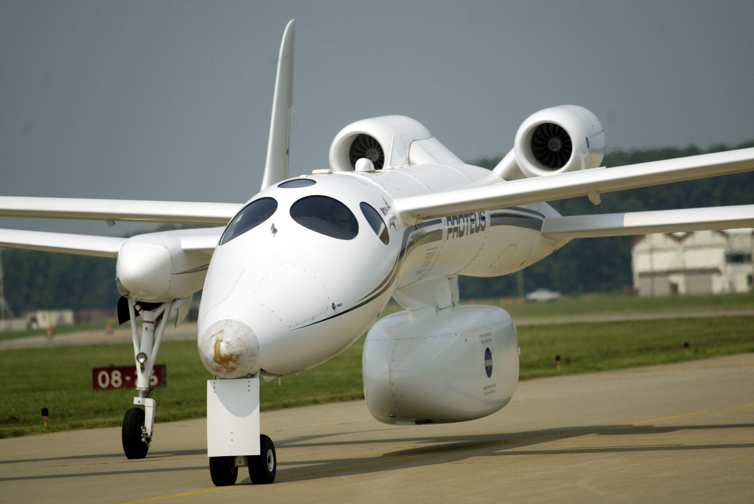Burt Rutan's Proteus plane on a runway.