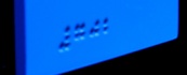 Closeup of raised braille code on the interior signs