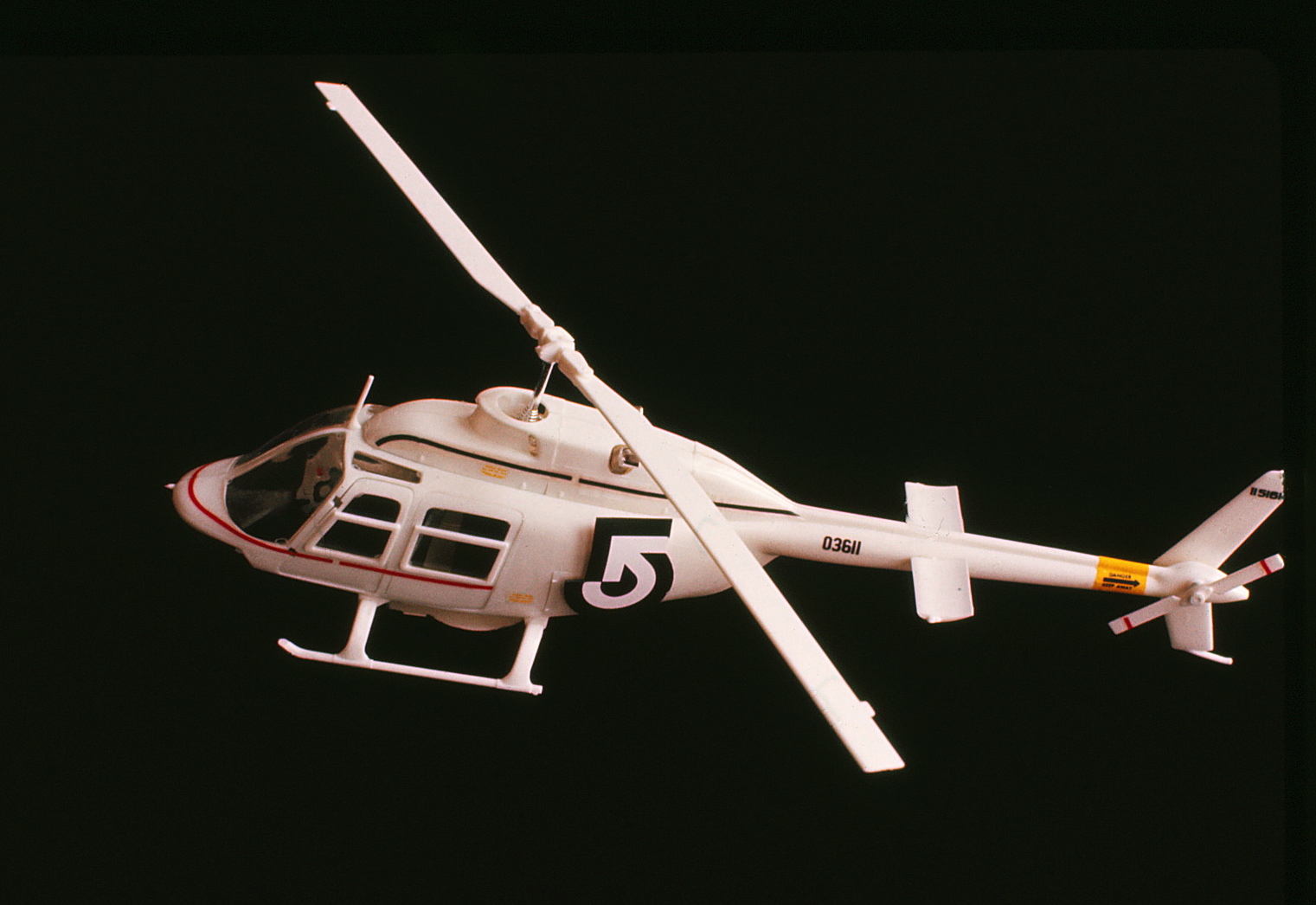 Model of helicopter with logo on it