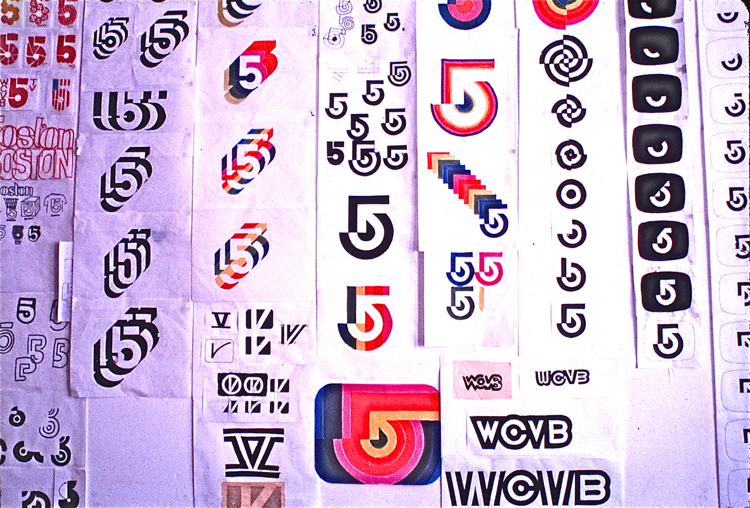 Large board featuring development of logo ideas
